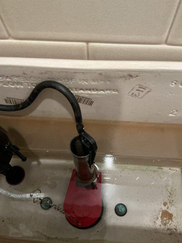 Responded to callback for toilet malfunction following previous repair attempt. Upon inspection, identified improperly installed flush valve assembly with misaligned flapper chain causing incomplete seal and continuous running. Adjusted chain length to manufacturer specifications, ensuring proper flapper operation and complete closure. Tested flush mechanism multiple times to verify reliable operation and proper tank refill. Inspected fill valve and supply line connections for leaks or damage; all connections secure with no visible water leakage. Toilet now functioning correctly with full flush cycle and proper water shutoff.