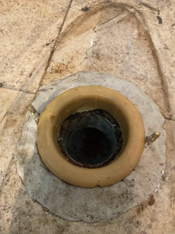 Responded to a multi-unit building for clogged toilet with water infiltration to unit below. Pulled and reset two toilets with replacement of failed wax rings and installation of new cast iron closet flanges. Performed main line rodding with Spartan equipment to clear blockage, followed by camera inspection to verify clearance and locate any additional issues in the drainage system.