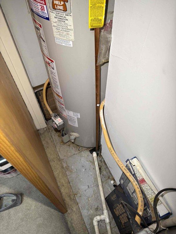 Responded to leak originating from ceiling in unit below. Upon inspection of mechanical room and HVAC equipment area, assessed copper piping, water heater connections, and drainage systems for source of water intrusion. Documented existing plumbing infrastructure including copper supply lines, PVC drainage piping, and water heater installation to identify leak pathway and coordinate repairs with affected units.