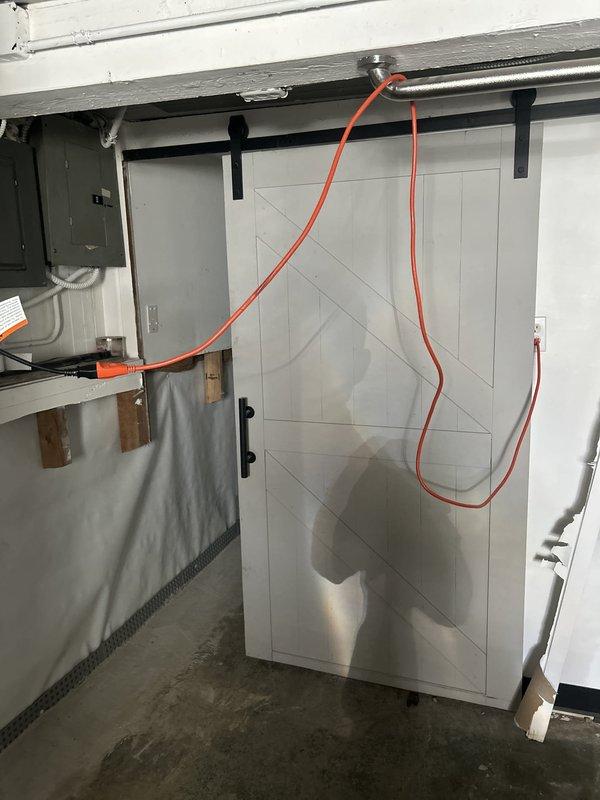 Successfully relocated a tanked water heater installation from its original position to the opposite wall within the utility area. The project involved disconnecting and repositioning an A.O. Smith tank water heater, including the recirculation pump system mounted on top of the unit. All supply and return plumbing connections were reconfigured, including copper water lines and PVC venting, with proper fittings and support brackets installed to meet code requirements. Electrical connections were relocated and secured, ensuring proper power supply to both the water heater and recirculation pump. The installation was completed with all components properly mounted, connections tested for leaks, and the system restored to full operational status.