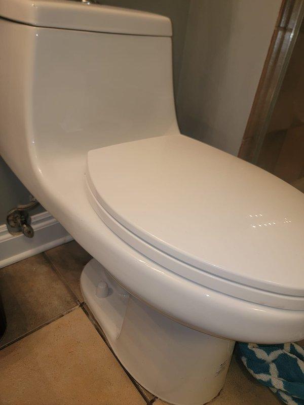 Responded to a service call for a leaking toilet caused by a failed wax ring seal. Removed and reset the toilet fixture, replaced the deteriorated wax seal with a new one, reinstalled the unit with proper bolting and alignment, and tested for leaks to ensure a watertight seal at the floor flange connection.