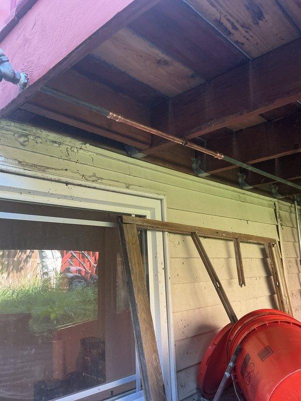 Responded to service call for above-ground burst pipe supplying backyard garden spigot. Upon arrival, located damaged copper supply line in exterior porch area with exposed structural elements. Assessed pipe failure point, shut off water supply to affected line, and removed compromised section of piping. Installed new copper pipe segment using appropriate fittings and soldered connections to restore water flow to garden spigot. Pressure tested repair to verify integrity of joints and ensure no leaks present. Restored water supply and confirmed proper operation of backyard spigot fixture.