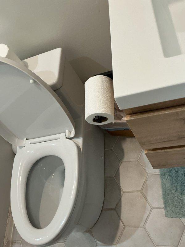 Responded to customer report of sewage smell throughout residence. Upon arrival, conducted comprehensive inspection of plumbing fixtures and drain systems to identify source of odor. Performed visual assessment of bathroom facilities, including toilet, drainage components, and ventilation systems. Inspected toilet wax ring seal, flange connection, and bowl integrity for potential leak points that could allow sewer gas infiltration. Verified proper water levels in toilet trap to ensure adequate seal against sewer gases entering living space. Examined all visible plumbing connections and drain lines for signs of leakage or compromised seals. Documented bathroom conditions with photographic evidence showing fixtures and surrounding areas for service records.