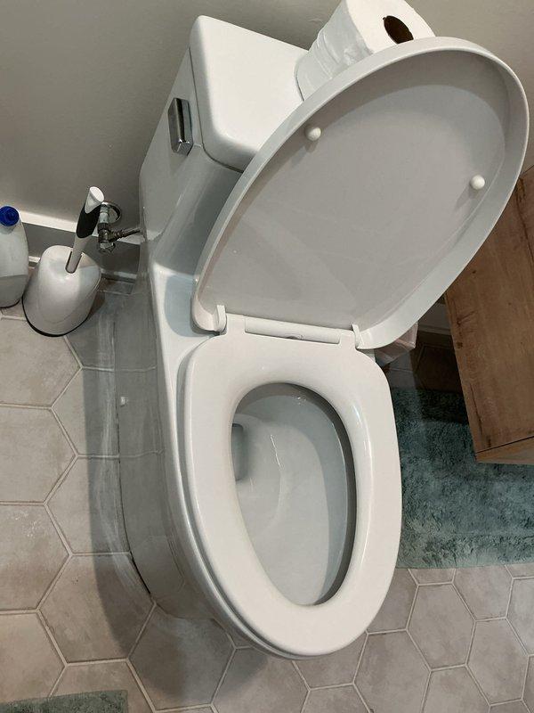 Responded to customer report of sewage smell throughout residence. Upon arrival, conducted comprehensive inspection of plumbing fixtures and drain systems to identify source of odor. Performed visual assessment of bathroom facilities, including toilet, drainage components, and ventilation systems. Inspected toilet wax ring seal, flange connection, and bowl integrity for potential leak points that could allow sewer gas infiltration. Verified proper water levels in toilet trap to ensure adequate seal against sewer gases entering living space. Examined all visible plumbing connections and drain lines for signs of leakage or compromised seals. Documented bathroom conditions with photographic evidence showing fixtures and surrounding areas for service records.