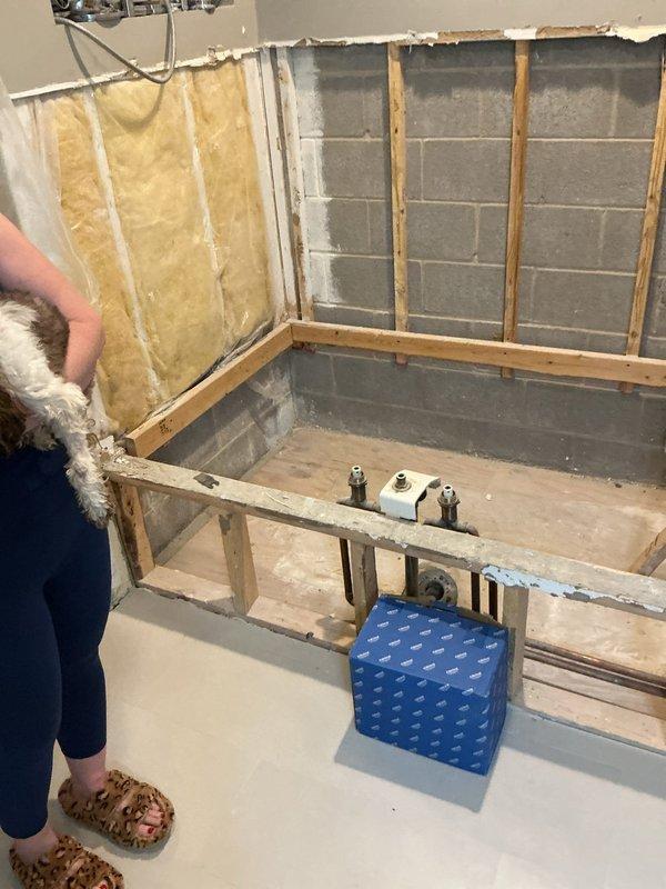 Conducted on-site assessment of bathroom renovation project to prepare plumbing fixture estimate. Documented exposed copper water supply lines, wall framing, and bathtub rough-in installation with valve assemblies in place, requiring coordination with project managers for comprehensive fixture pricing and scope determination.