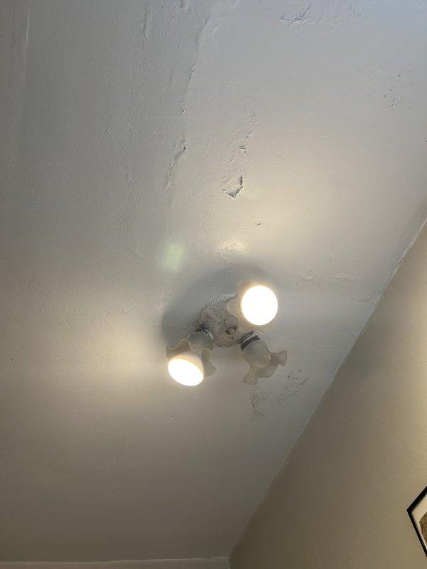 Responded to water leak complaint in older residential property. Upon arrival, contacted homeowner as requested prior to beginning diagnostic assessment. Conducted thorough inspection of interior wall cavity to locate source of reported leak. Examined plumbing fixtures and supply lines in affected area, including bathroom facilities. Documented conditions with photographic evidence showing bathroom fixtures and ceiling areas for reference. Assessment revealed potential moisture intrusion requiring further investigation of concealed piping within wall structure. Appointment rescheduled to allow for proper access and repair of affected plumbing system.
