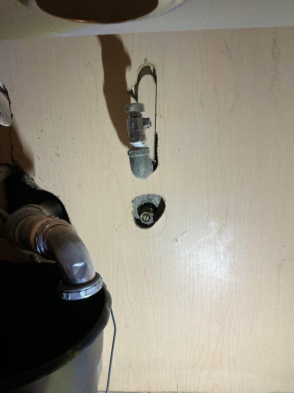 Completed kitchen faucet replacement and repair at residential property. Installed new stainless steel sink fixtures with proper mounting beneath granite countertop, ensuring secure basin placement and drain assembly. Accessed plumbing connections through ceiling access points to complete water supply line connections and verify proper installation of chrome fittings and supply pipes without leaks.