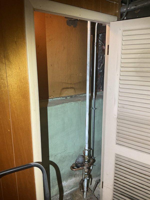 Completed installation of new plumbing piping system in basement utility area, including PVC drainage lines, copper water supply lines, and associated mechanical connections. Installed piping runs across ceiling joists with proper support and secured all connections to existing HVAC system and mechanical equipment, ensuring proper routing and clearances per code requirements.