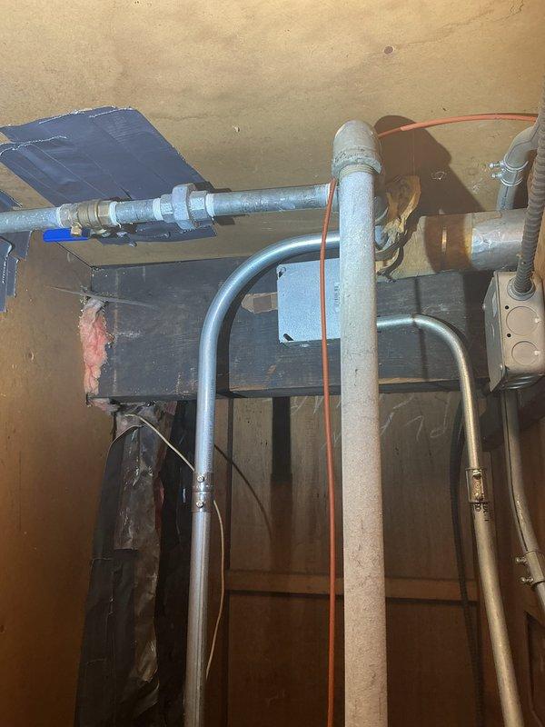 Completed installation of new plumbing piping system in basement utility area, including PVC drainage lines, copper water supply lines, and associated mechanical connections. Installed piping runs across ceiling joists with proper support and secured all connections to existing HVAC system and mechanical equipment, ensuring proper routing and clearances per code requirements.