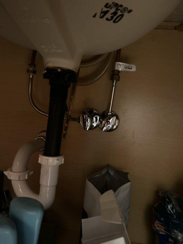 Completed garbage disposal replacement beneath kitchen sink. Disconnected existing unit from drain assembly and electrical supply, removed old disposal, and hauled away for proper disposal. Installed new garbage disposal unit with secure mounting to sink flange, connected discharge drain line to existing P-trap configuration, and verified all plumbing connections for proper seal and alignment. Restored electrical connection, tested unit operation for proper function and drainage, and confirmed no leaks at mounting points or drain connections.