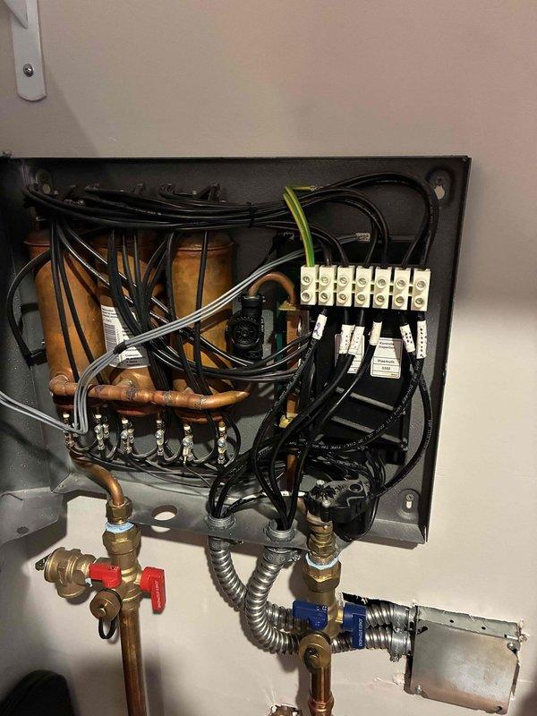 Responded to service call for water heater inspection and low water flow complaint at kitchen faucet. Upon arrival, performed comprehensive inspection of tanked water heater system, examining internal components including copper piping manifold, electrical connections, brass valves, and shutoff mechanisms. All connections, wiring, and heating elements were inspected for proper operation and safety compliance. Water heater found to be functioning within normal parameters with no immediate issues identified.

Investigated low water flow concern at kitchen faucet and traced issue to whole-house water filtration system installed on main copper supply line. Inspection revealed GE brand inline filter housing with severely discolored and clogged filter cartridge, exhibiting brownish-yellow sediment buildup that was significantly restricting water flow throughout the residence. Filter cartridge had reached end of service life and required immediate replacement. Documented existing filter model