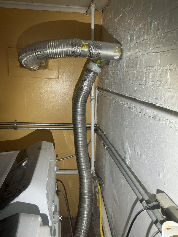 Conducted site assessment of utility room to provide quote for laundry hookup installation. Inspected existing plumbing infrastructure, HVAC ductwork, and available space for washer and dryer connections. Documented current configuration of water supply lines, drainage access points, and electrical conduit routing to determine feasibility and scope of work required for proper appliance installation.