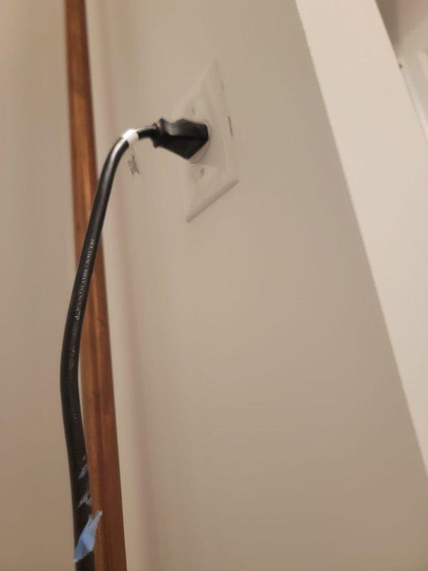 Responded to commercial plumbing service warranty call for operational sump pump system. Upon arrival, conducted thorough inspection of sump pump installation and associated components. Verified proper electrical wiring routing along interior wall junction with secure cable management. Inspected pressure reducing valve assembly with brass body and compression fittings on copper piping, confirming appropriate pressure regulation settings and valve functionality. Documented system configuration and component conditions through photographic documentation. All equipment found operating within normal parameters with no immediate service requirements identified.
