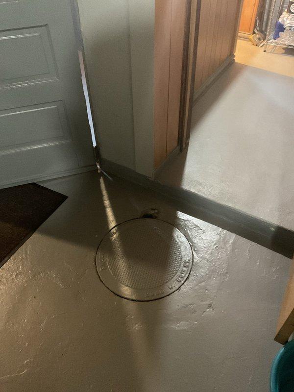 Responded to complaint of persistent sewage odor emanating from basement catch basin and floor drains, affecting basement and main floor air quality. Conducted thorough inspection of basement drainage system, including multiple floor drains and sewer pit. Evaluated drain trap conditions, checked for proper water seal in catch basin, and assessed potential sewer gas infiltration points following recent municipal storm pipe repairs. Documented moisture conditions around floor drains and provided estimate for cleaning, deodorizing, and restoring proper trap seals to eliminate odor issue.