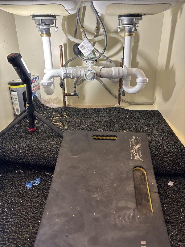 Responded to service call for leaking kitchen faucet and loose bathroom sink fixture. Inspected under-sink plumbing in kitchen, examining drain assemblies, P-trap configuration, and supply line connections for signs of leakage. Tightened bathroom sink fixture mounting hardware to eliminate movement and prevent water seepage in secondary location. Both fixtures secured and tested for proper operation with no active leaks detected upon completion.