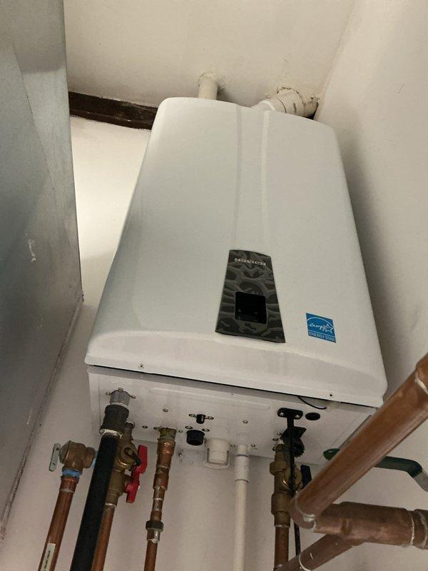 Responded to service call for Navien tankless water heater system requiring component replacement. Successfully removed and replaced malfunctioning three-way valve and circulating pump to restore proper hot water circulation throughout the residence. Verified all plumbing connections, tested system operation, and confirmed proper flow and temperature control upon completion.
