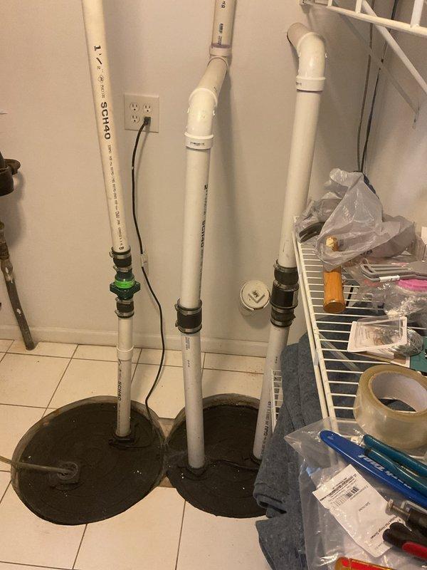 Responded to an overflowing catch basin call and performed complete system assessment. Cleared the blockage causing the overflow condition, inspected the drainage system and associated plumbing connections, and verified proper flow restoration. Documented pre-existing conditions including stained concrete surfaces around the catch basin area and confirmed all PVC drainage pipes and connections were functioning correctly after service completion.