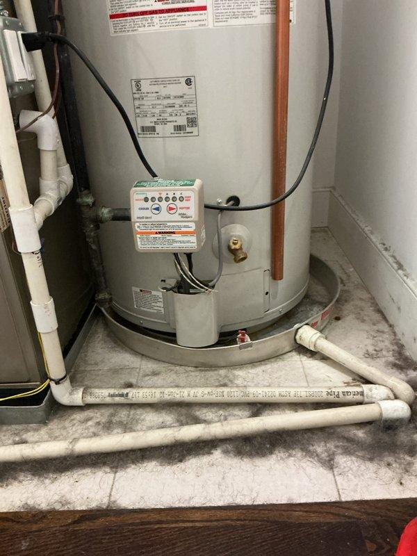 Performed preventative maintenance and full tank flush on 13-year-old electric water heater at owner-occupied residence. Inspected unit for signs of wear, corrosion, and potential end-of-life indicators given age of equipment. Drained sediment buildup from tank bottom through drain valve, flushed system with fresh water supply until discharge ran clear. Verified proper operation of temperature and pressure relief valve, tested electronic control module functionality and indicator lights. Examined anode rod condition, checked all electrical connections and wiring for signs of deterioration, and inspected copper supply lines and PVC drainage piping for leaks or damage. Confirmed drain pan placement and condition. Unit operating within normal parameters at time of service; advised customer of approximate remaining service life based on current condition and manufacturer specifications.
