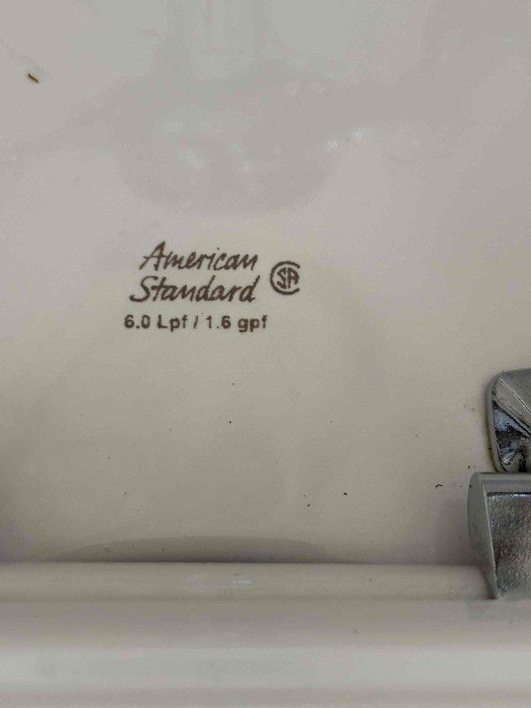 Responded to service call for loose toilet fittings in a 105-year-old building. Inspected and tightened mounting hardware on tankless toilet system (American Standard, 1.6 gpf/6.0 Lpf). Verified all chrome-plated fittings were properly secured to prevent wobbling and ensure stable operation. Toilet showed no signs of leaks or functional impairment. Documented equipment condition with photographs for service records.