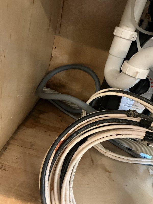 Performed bathroom sink plumbing repair involving the P-trap assembly and drain tailpiece connections beneath the vanity. Utilized pipe wrench to tighten chrome fittings and ensure proper seal at all connection points to eliminate leaks. Verified supply line connections and shut-off valve operation, confirming all plumbing components were secure and functioning correctly upon completion.