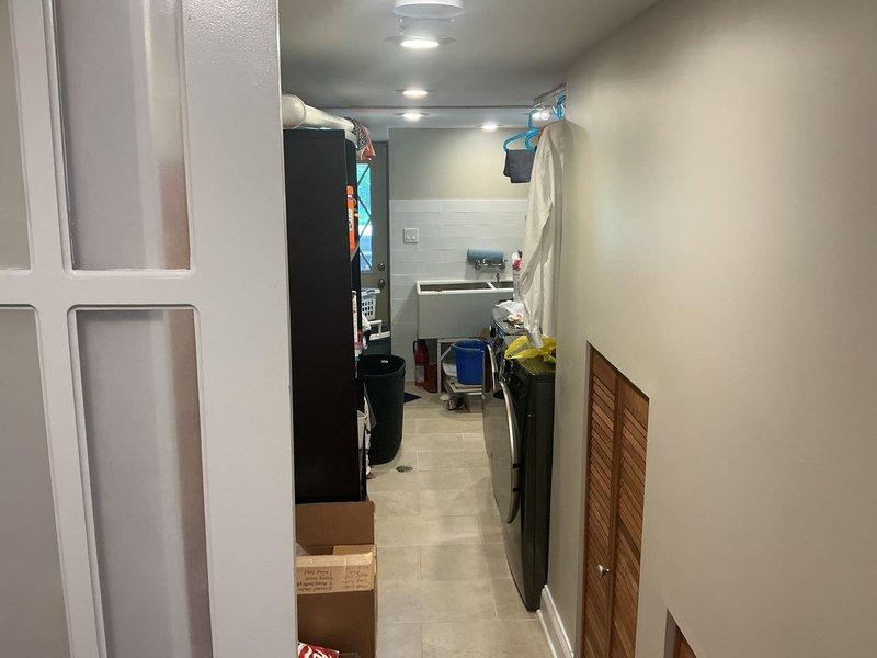 Inspected and assessed plumbing system requiring repair work in residential property. Documented existing conditions including plumbing vent lines and drain pipes routed through attic space, with multiple PVC lines of varying diameters running through ceiling joists. Repair proposal sold and approved, requiring down payment to proceed with scheduled plumbing repairs.