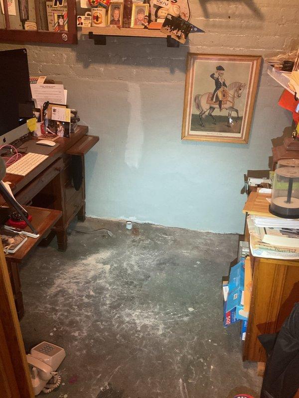 Conducted comprehensive assessment of existing basement drainage and ejector pump system experiencing recurring water intrusion during heavy rainfall events. Evaluated 12-year-old Zoeller pump installation with dual pump configuration and alternating switch mechanism, along with disconnected marine battery backup system. Inspected all basement drains connected to ejector pit, with exception of one exterior drain causing continuous pump cycling during precipitation. Assessed system's capability to function as overhead sewer configuration and identified performance deficiencies contributing to multiple flooding incidents resulting in significant property damage. Documented current one-way valve installation and overall system integrity. Photographed existing conditions including basement utility areas, pump location, and affected spaces. Provided technical evaluation of drainage system performance and prepared recommendations for enhanced waterproofing solution to prevent future water in