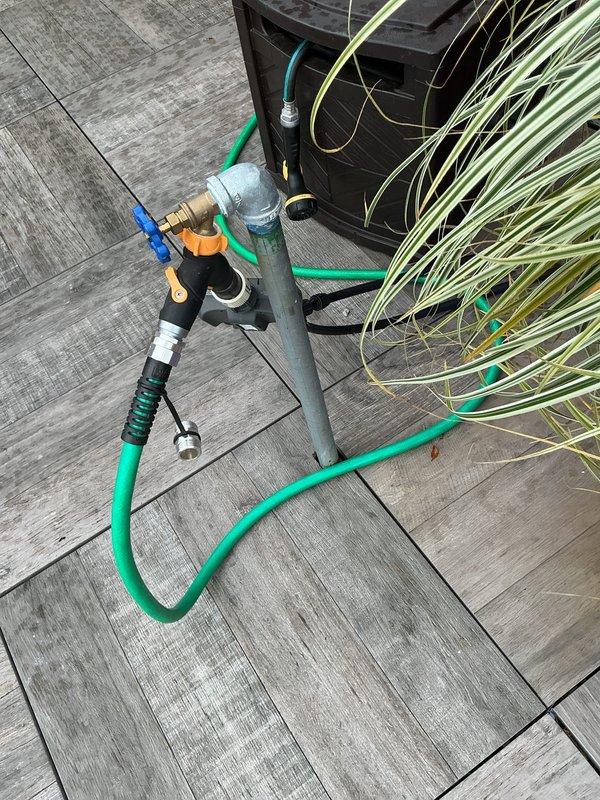 Responded to service call regarding noise occurring when activating rooftop water spigot connected to irrigation system. Performed comprehensive inspection of outdoor spigot assembly and associated piping on roof level. Examined brass fittings, valve connections, and hose attachments for proper installation and potential sources of noise or vibration. Inspected vertical pipe mounting, blue-handled valve operation, and connection points between metal piping and garden hose adapter. Evaluated interior plumbing connections including copper pipe runs, PVC supply lines, and pressure regulation components in mechanical room. Tested water flow through rooftop spigot system while monitoring for abnormal sounds, water hammer, or loose fittings. Verified all valve assemblies operate smoothly without binding or chattering. Confirmed no leaks present at any connection points, joints, or valve bodies throughout the irrigation supply system. System functioning properly with noise issue addressed thr