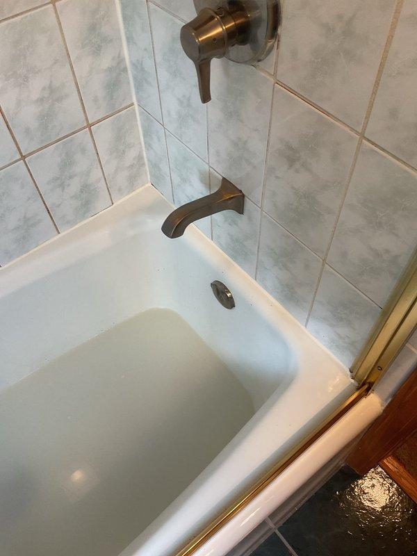 Responded to service call for clogged bathtub drain and suspected toilet leak. Successfully rodded and cleared the bathtub drain to restore proper water flow. Performed inspection of toilet installation and confirmed leaking wax ring seal at floor flange. Removed toilet from mounting flange, replaced deteriorated wax ring with new seal, and reinstalled toilet to manufacturer specifications. Verified proper seating and tested for leaks. Both fixtures are now functioning properly with no active leaks detected.