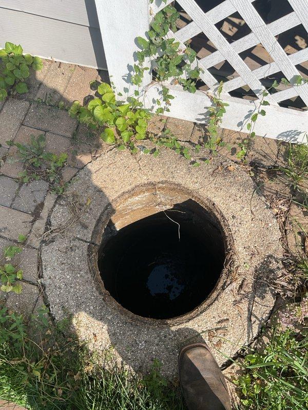 Performed comprehensive home inspection including catch basin pump maintenance, hydrojetting, and camera inspection services. Accessed outdoor drainage system through concrete catch basin opening in backyard area covered with pea gravel and surrounded by interlocking pavers. Pumped catch basin to remove accumulated water and debris, then deployed hydrojetting equipment to clear blockages and restore proper flow through the drain lines. Conducted video camera inspection of the sewer system to assess interior pipe condition and identify any structural issues or remaining obstructions. Verified proper drainage function at interior plumbing fixtures, including bathroom sink with running water test to confirm restored flow and eliminate backup concerns. All drainage systems operating normally upon completion of service.