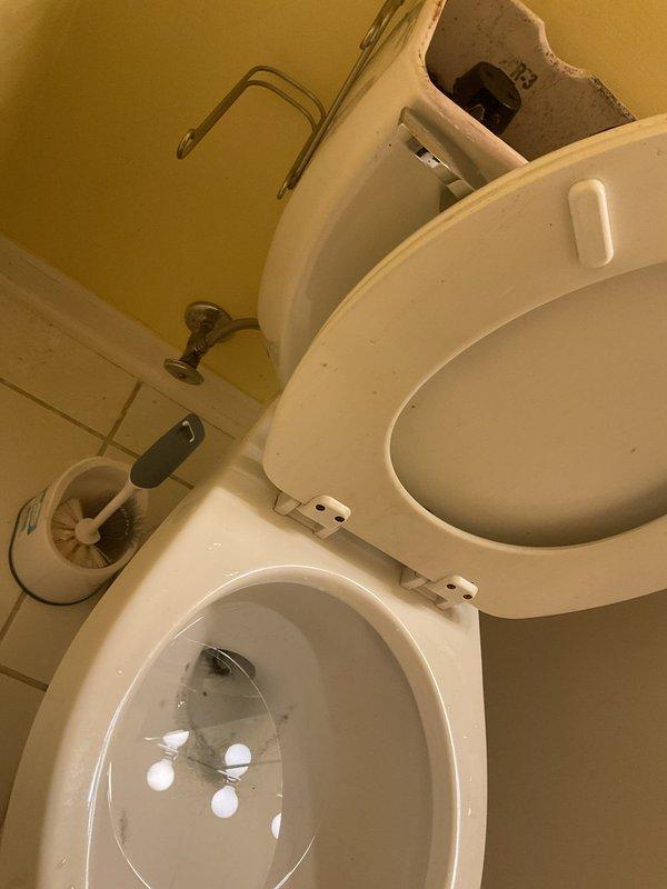 Responded to clogged toilet in second-floor bathroom of condo unit. Upon arrival, found toilet experiencing chronic drainage issues with visible staining and buildup in bowl. Removed tank lid to inspect internal components and fill valve operation. Utilized closet auger to clear obstruction in toilet trap and drain line, successfully restoring proper flush function and drainage. Tested flush mechanism multiple times to verify complete clearance and proper water flow. Advised occupant on proper usage and maintenance to prevent future clogs.