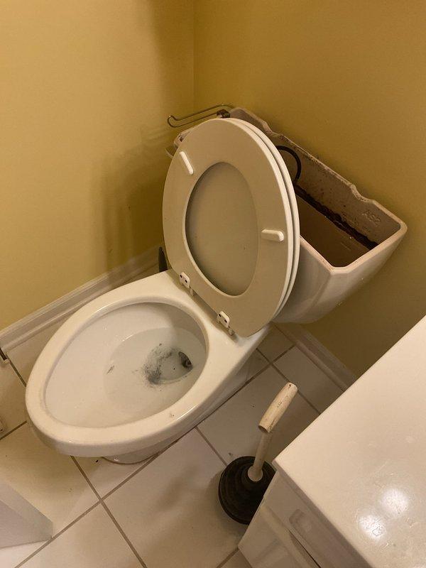 Responded to clogged toilet in second-floor bathroom of condo unit. Upon arrival, found toilet experiencing chronic drainage issues with visible staining and buildup in bowl. Removed tank lid to inspect internal components and fill valve operation. Utilized closet auger to clear obstruction in toilet trap and drain line, successfully restoring proper flush function and drainage. Tested flush mechanism multiple times to verify complete clearance and proper water flow. Advised occupant on proper usage and maintenance to prevent future clogs.