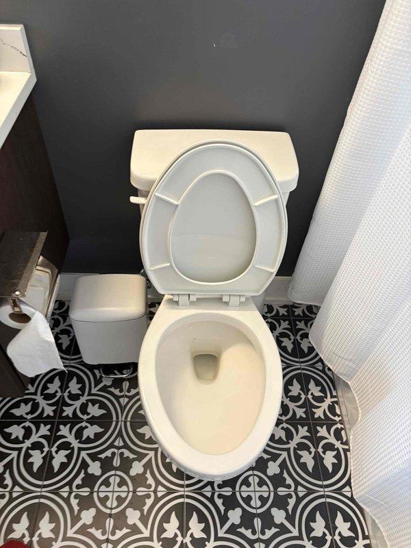 Responded to low water pressure complaint in downstairs bathroom. Upon inspection, diagnosed and resolved toilet tank fill valve issue causing inadequate water flow during flush cycle. Adjusted water supply valve and tested flush mechanism to restore proper water pressure and complete bowl evacuation.