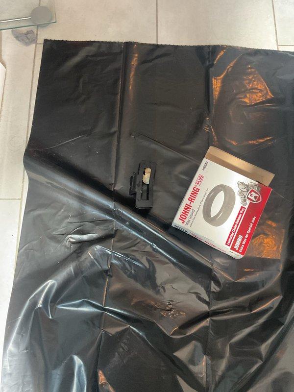 Responded to clogged toilet that would not clear with plunging after a large hair clip was flushed by a toddler. Protected work area with drop cloth and removed toilet from floor flange to access and clear obstruction from the trapway. Retrieved foreign object, reinstalled toilet with new wax ring seal, and tested for proper flush operation and drainage.