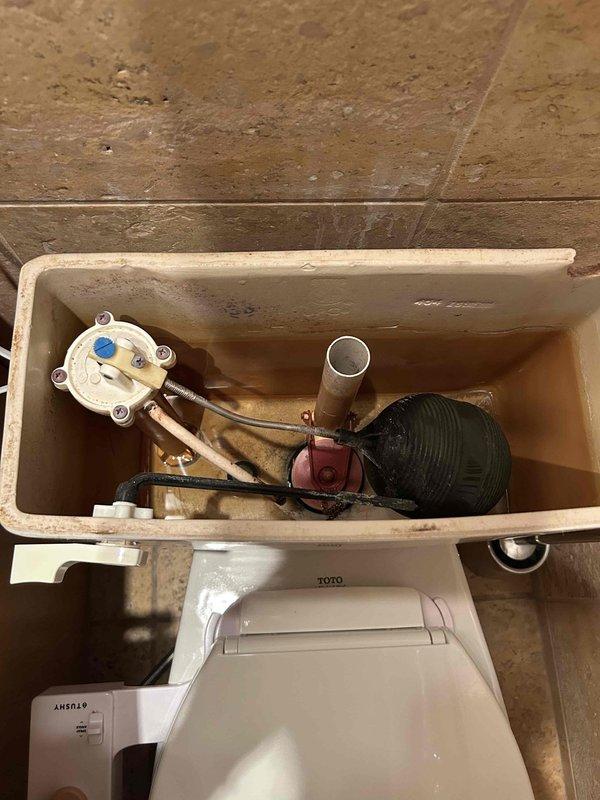 Responded to service call for two running toilets and garbage disposal inspection. Removed tank lids and inspected internal flush mechanisms on both TOTO toilets. Identified worn flapper valves and misadjusted float assemblies causing continuous water flow. Replaced defective flappers, adjusted float heights, and tested flush cycles to ensure proper operation and water shutoff. Inspected garbage disposal unit and verified functionality. All fixtures restored to proper working condition with no leaks detected.