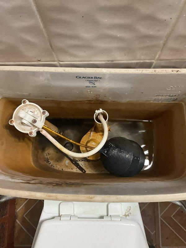 Responded to service call for toilet tank not filling properly. Upon inspection, diagnosed faulty fill valve assembly preventing water from entering the tank. Replaced defective fill valve with new Glacier Bay-compatible unit, reconnected refill tube to overflow pipe, adjusted float mechanism to proper water level, and tested flush cycle to verify complete tank refill and proper operation. System restored to full functionality.