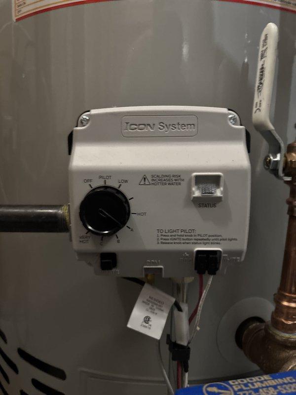 Completed installation of A.O. Smith residential water heater in basement utility area. Connected hot and cold water supply lines using copper piping with brass shut-off valves and fittings, installed ICON System gas valve control unit with proper temperature settings, and verified all plumbing connections for proper operation. Unit tested and confirmed operational with gas pilot light functioning and all safety features in place.
