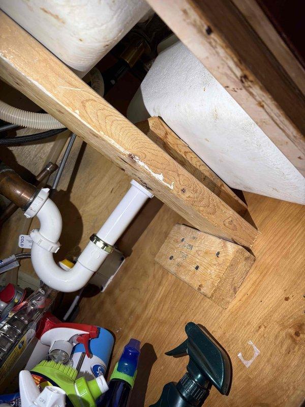 Completed annual VIP maintenance service on tankless water heating system. Performed comprehensive inspection of multi-zone water distribution manifold with ball valve isolation points, verified proper operation of all shut-off valves, and confirmed digital monitoring equipment displaying normal operating parameters at 181 units. Inspected under-sink plumbing connections including P-trap configuration and drainage components, checked pipe insulation integrity, and documented system condition through photographic records for maintenance history.