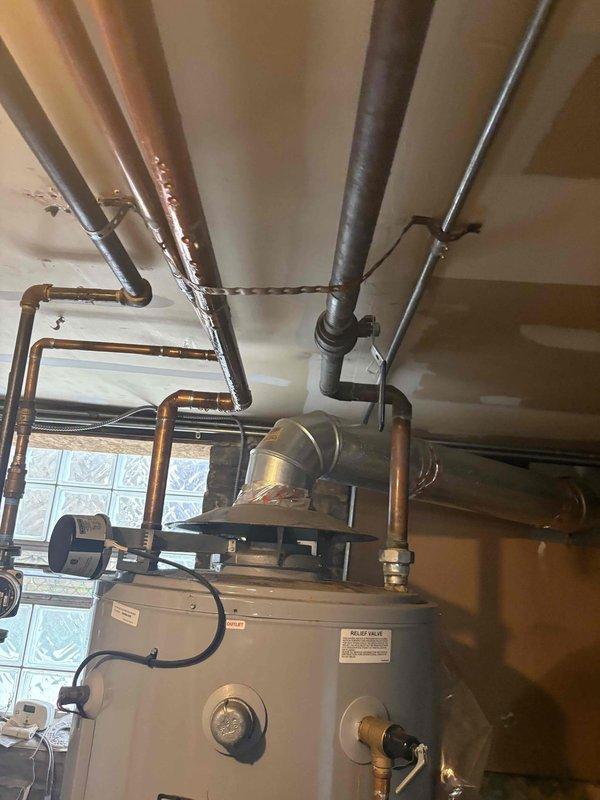 Responded to emergency no-water situation caused by failed 100-gallon tanked water heater with severe leak. The 6.5-year-old unit, which initially presented as a minor drip, had deteriorated to a significant leak requiring immediate shutdown of the water supply to the entire building. Completed same-day replacement of the failed water heater, restoring hot water service to the facility. All plumbing connections, venting system, and safety controls were installed per code requirements and tested for proper operation.