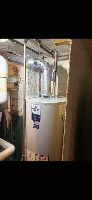 Responded to service request for hot water heater evaluation. Upon inspection, completed installation of a 50-gallon Bradford White tanked water heater in the basement utility area with proper copper piping connections and code-compliant installation. Customer indicated unit may be under manufacturer warranty for future reference.