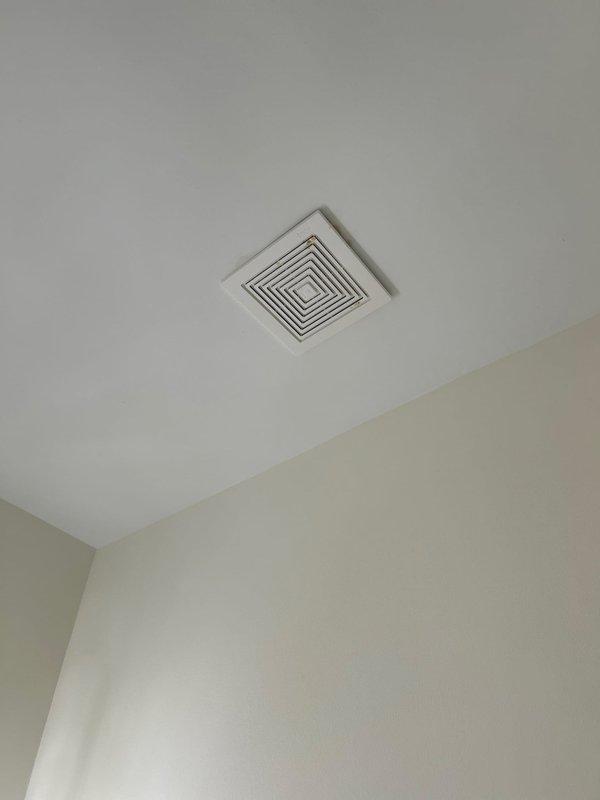 Responded to water leak service call and conducted thorough inspection of bathroom plumbing fixtures. Examined Kohler shower assembly including chrome faucet, diverter valve, and associated trim components mounted on tiled shower wall. Inspected porcelain bathtub fixture and drain assembly for signs of moisture intrusion or active leaking. Checked ceiling-mounted ventilation grille and surrounding areas for water damage or staining that could indicate leak source from above. All fixtures appeared functional with minor water spotting consistent with normal use. No active leaks detected during inspection period.