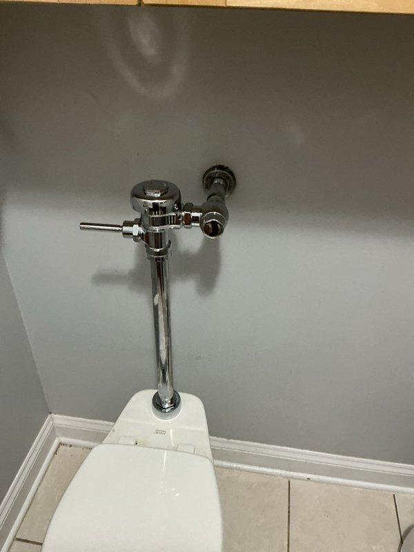 Responded to a school facility for two toilet issues. Serviced a tankless flushometer-style toilet that was experiencing continuous flushing and excessive water waste due to a malfunctioning diaphragm assembly. Replaced the worn diaphragm and relief valve components within the flush valve body to restore proper flush cycle timing. Adjusted the tailpiece to ensure proper water flow shutoff. 

Addressed a second issue with a small-capacity toilet experiencing slow tank refill. Diagnosed a restricted fill valve caused by debris buildup and mineral deposits. Replaced the complete fill valve assembly and adjusted the water supply stop valve to optimize fill rate while maintaining appropriate tank water level for proper flush performance.