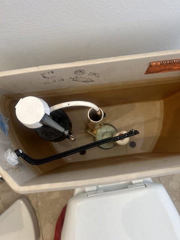 Responded to service call for toilet tank that would not fill and could not retain water when manually filled. Upon inspection, found faulty fill valve assembly and compromised flush valve causing water to continuously leak from tank into bowl. Removed and replaced defective fill valve with new assembly, adjusted float mechanism to proper water level, and installed new flapper seal on flush valve to prevent tank drainage. Tested system operation multiple times to confirm proper filling cycle, verified tank maintains water level, and ensured complete flush function. Tank now fills automatically and maintains proper water level without leakage.