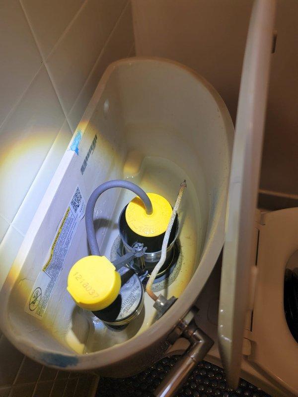 Responded to multiple plumbing issues including clogged drains and toilet repairs. Removed toilet tank lid and inspected flush valve mechanism and fill valve assembly, confirming proper operation of flapper seal and internal components. Addressed clogged toilet by clearing obstruction and verifying proper drainage and flush function. Tightened loose shower faucet to eliminate movement and ensure proper mounting. Inspected under-sink P-trap assembly and drain lines for blockages, confirming clear flow through PVC drainage system. Examined basement water supply line for potential clogs or routing concerns, verified proper water flow and pressure throughout the system. All fixtures tested and returned to normal operation upon completion.