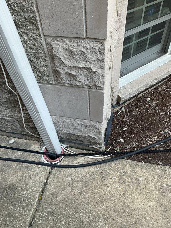 Responded to reports of intermittent sewage odor at exterior of six-unit building and recent basement water line backup. Conducted site inspection of building perimeter, focusing on waste pump system and drainage infrastructure. Examined exterior foundation areas, utility access points, and grade conditions around building where odor was reported, particularly areas prone to water accumulation during rain events. Documented existing conditions including exterior wall construction, ground-level utilities, and landscaping drainage patterns. Assessed potential sources of sewage smell including waste pump discharge lines, vent system integrity, and possible subsurface drainage issues. Evaluated correlation between reported odor occurrences and rainfall, suggesting potential groundwater infiltration or compromised waste pump discharge piping. Photographed critical areas for estimate preparation and recommended further diagnostic work to identify specific failure points in waste pump system 