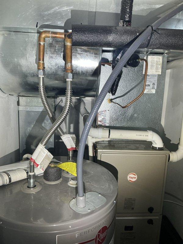 Responded to service call for sewer odor occurring specifically during laundry operation. Conducted thorough investigation of mechanical room housing water heater, HVAC equipment, and associated plumbing systems. Inspected floor drain in utility area and evaluated drainage system components including PVC piping configuration. Assessed potential causes of intermittent sewer gas infiltration related to laundry discharge and drainage venting. Documented existing conditions of mechanical equipment and plumbing connections, noting water heater installation and surrounding utility infrastructure for future removal quote preparation.
