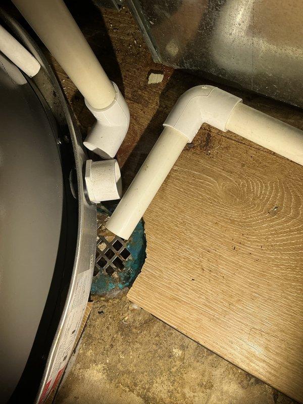 Responded to service call for sewer odor occurring specifically during laundry operation. Conducted thorough investigation of mechanical room housing water heater, HVAC equipment, and associated plumbing systems. Inspected floor drain in utility area and evaluated drainage system components including PVC piping configuration. Assessed potential causes of intermittent sewer gas infiltration related to laundry discharge and drainage venting. Documented existing conditions of mechanical equipment and plumbing connections, noting water heater installation and surrounding utility infrastructure for future removal quote preparation.
