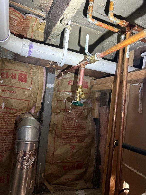 Installed new sump pump system with battery backup unit in basement area. Integrated system with existing plumbing infrastructure, connecting discharge piping to overhead copper lines with appropriate shutoff valve. Completed electrical connections for backup power supply to ensure continuous operation during power outages.