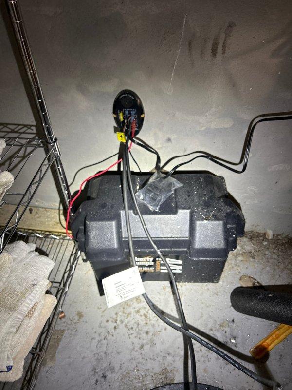 Installed new sump pump system with battery backup unit in basement area. Integrated system with existing plumbing infrastructure, connecting discharge piping to overhead copper lines with appropriate shutoff valve. Completed electrical connections for backup power supply to ensure continuous operation during power outages.