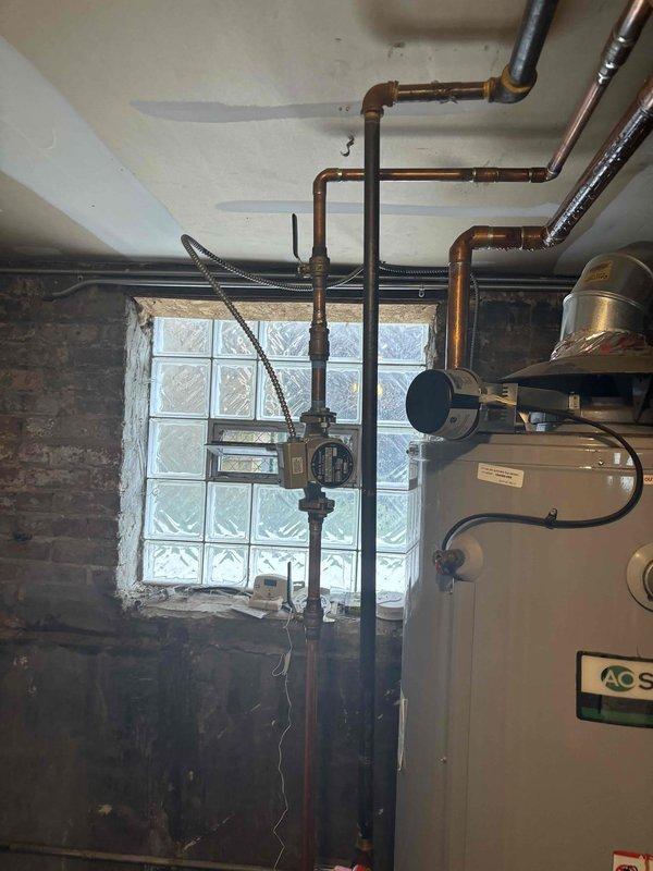 Completed installation of A.O. Smith water heater in residential basement with full copper piping connections to existing plumbing system. Installed all necessary fittings, valves, and overhead pipe connections, ensuring proper integration with home's water distribution network. Customer will remit remaining balance via check upon completion.