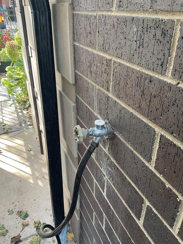 Completed comprehensive annual plumbing maintenance inspection of residential property with no reported issues. Performed visual assessment of exterior hose bib and connection integrity, confirming proper mounting and seal condition on exterior wall. Inspected under-sink plumbing access area, verifying supply lines, shut-off valves, and drain connections for leaks or deterioration, with all components found to be functioning within normal parameters.